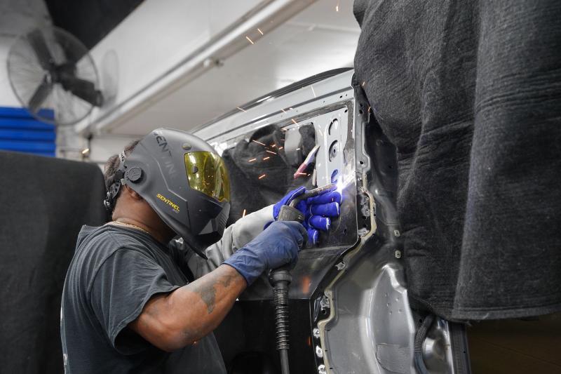 Metro Auto Body technician welding structural collision repair