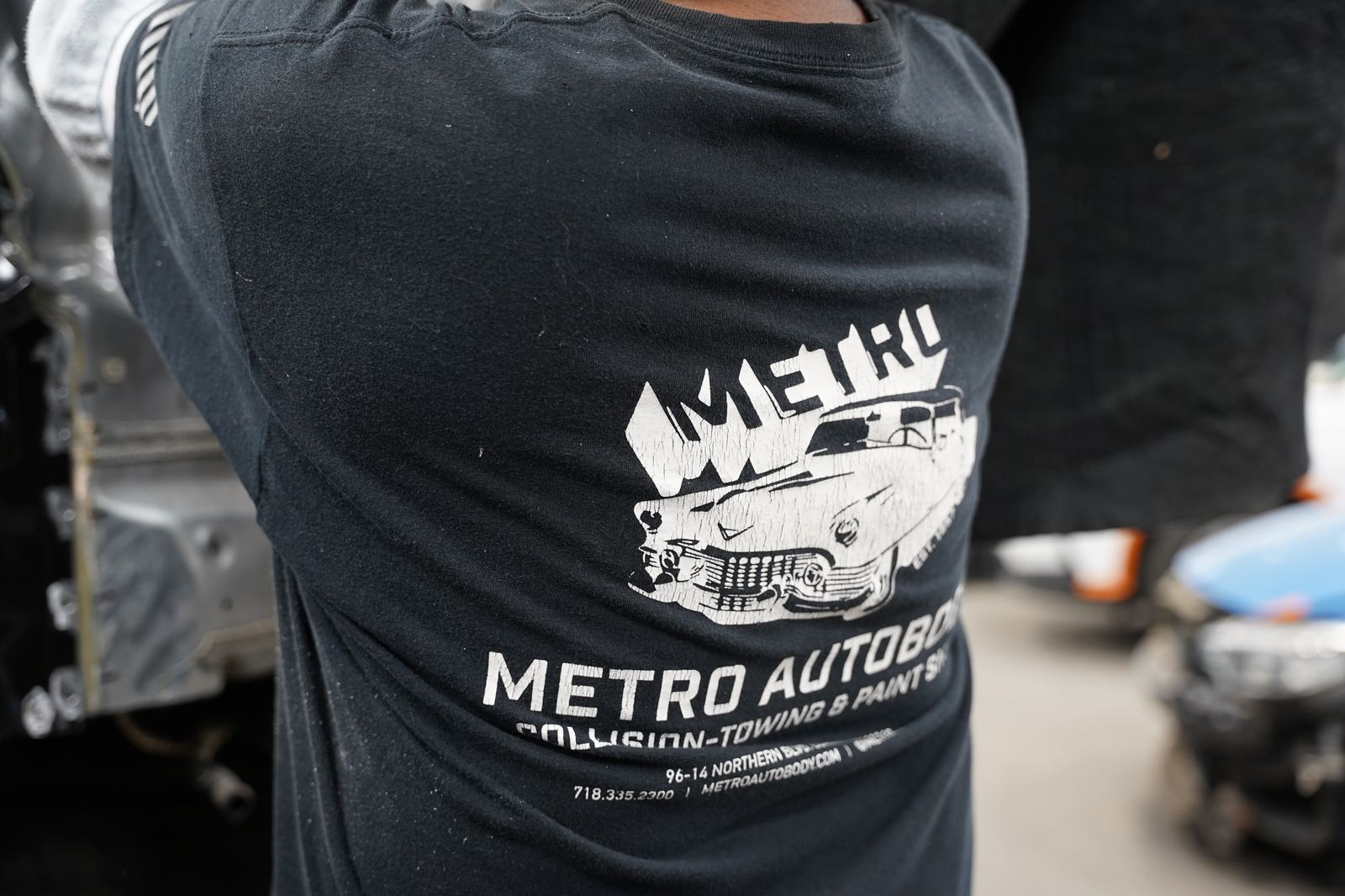 Close-up of the Metro Auto Body Collision, Towing & Paint Shop team shirt