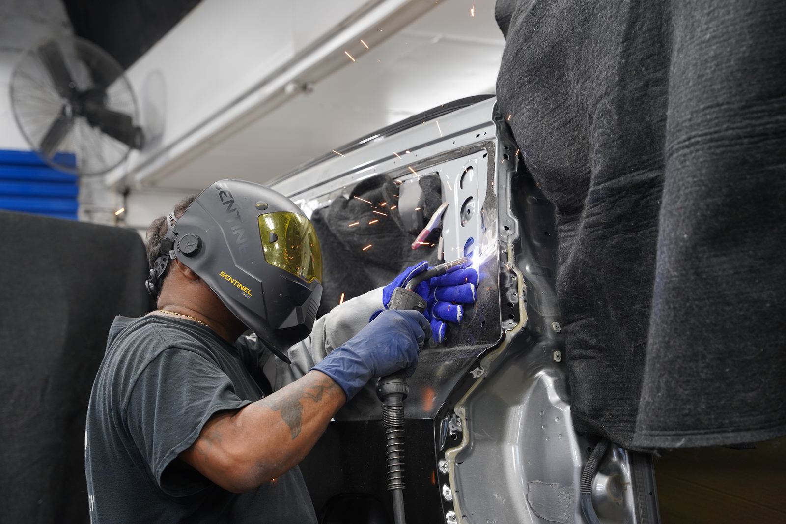 Metro Auto Body technician welding structural collision repair